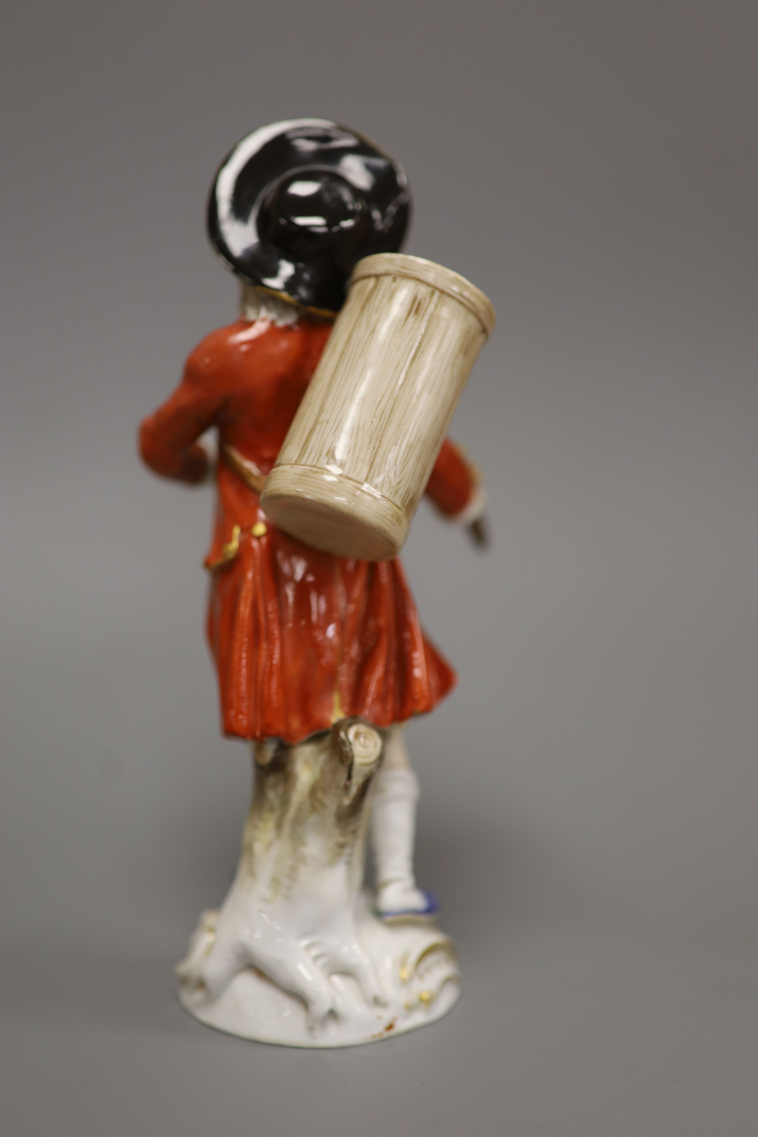 A late Meissen porcelain figure of a drummer boy, polychrome-decorated on scrolled base, height 15cm